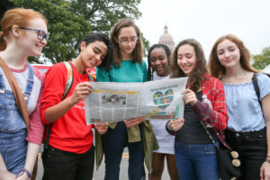 Festival teens looking at program 2017